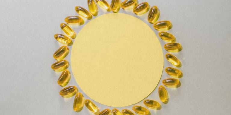 Supplement Kapseln die wie eine Sonne angeordnet sind.